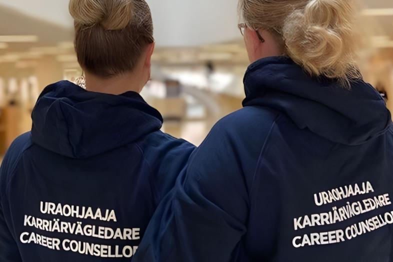 Two career counsellors in their work hoodies.