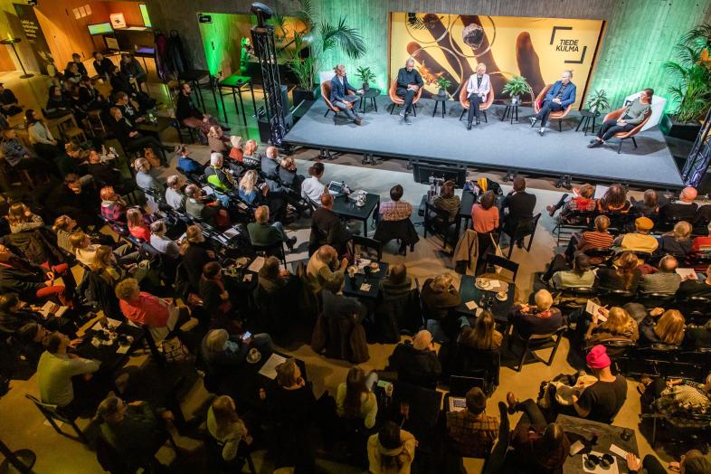 Audience following an event at the Think Corner stage.