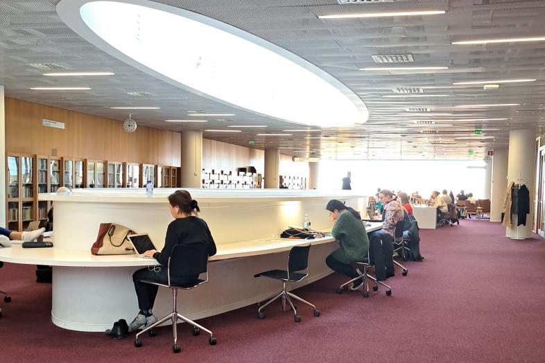 Students working with laptops at Kaisa House.