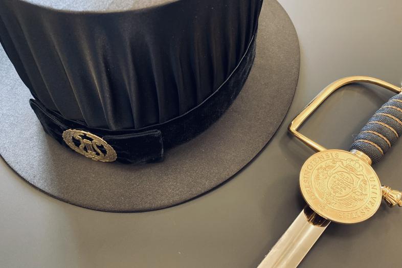 Doctoral hat and sword