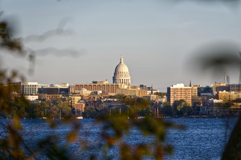 A lake in the forefront, with the skyline of the city of Madison in the background.