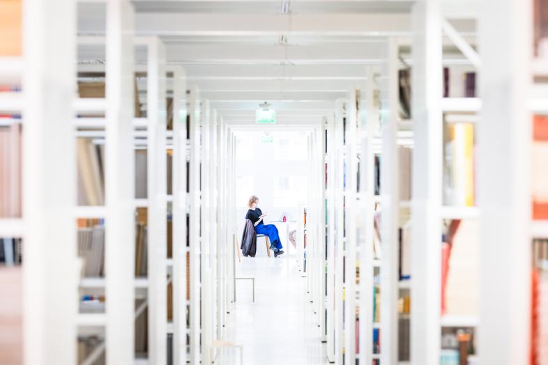 A customer reading in the library